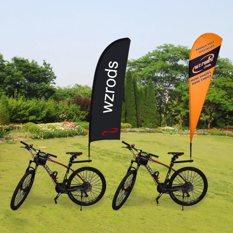 wzrods bike flag brackets with teardrop & banner poles on two XDS bikes Two bicycles with Wzrods teardrop flag and feather-style flags mounted on poles in natural outdoor setting