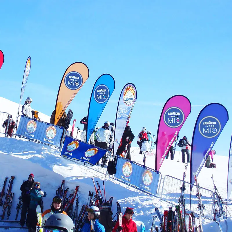 Ski resort brand activation with promotional flags in winter sports setting