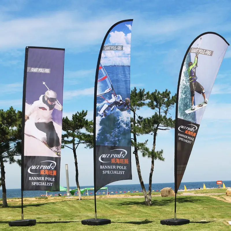 Wind-resistant feather flags on spike bases for outdoor events: ski, windsurf, and water sports advertising