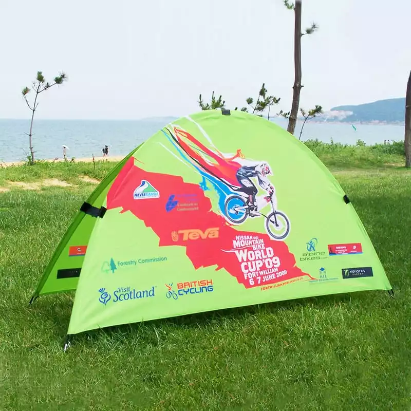 Outdoor event Half moon banner with 2009 Mountain Bike World Cup sponsor logos on beach backdrop