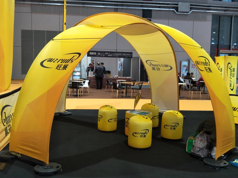 Yellow fabric arch banner stand used for indoor exhibition branding and event entrance visibility