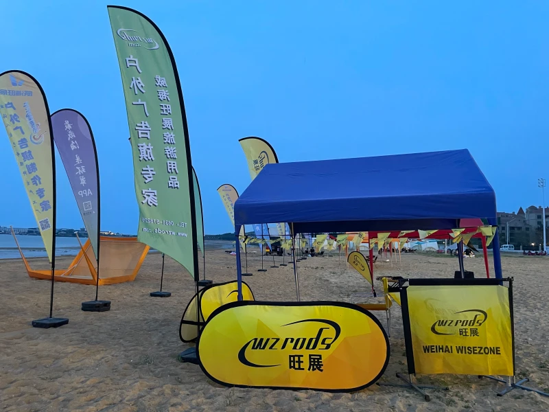 WZRODS feather flags with water bases at 2025 outdoor event, demonstrating stable branding in action.