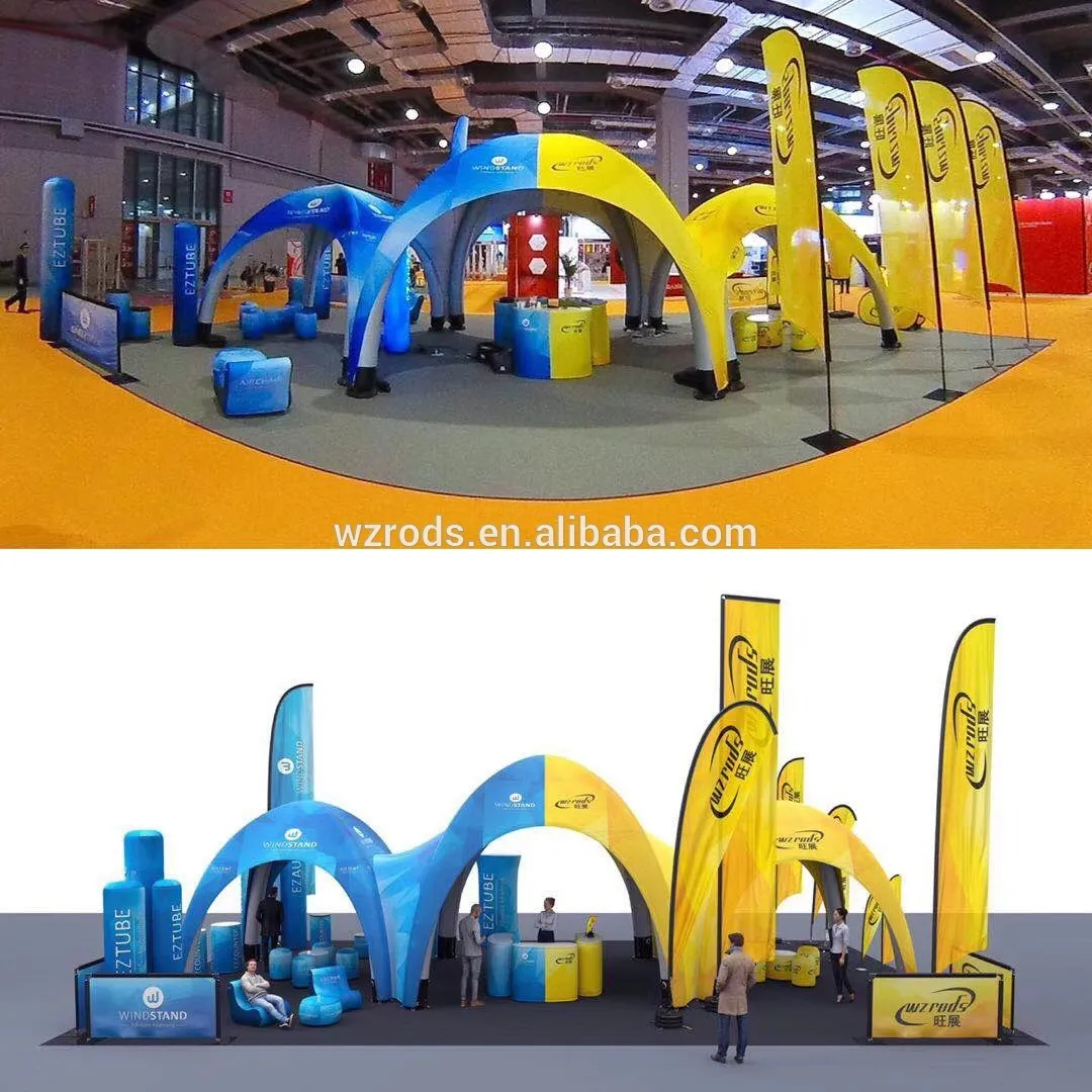 上海展会旺展展区,蓝色与黄色充气装饰鲜明对比,拱形与柱状结构印有品牌标识,橙色地毯与室内空间营造活泼氛围,吸引参观者互动。 上海展会旺展广告旗展区布置,蓝色与黄色充气拱形和柱状装饰,印有品牌标识与文字,橙色地毯铺地,室内展览空间背景,吸引观众驻足。