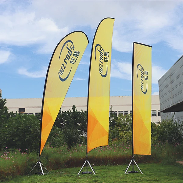 WZRODS teardrop and rectangle banners with gradient orange-yellow design in outdoor setting