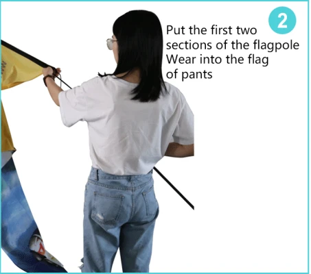 assemble feather flag step 2 Inserting first two flagpole sections into flag pants sleeve